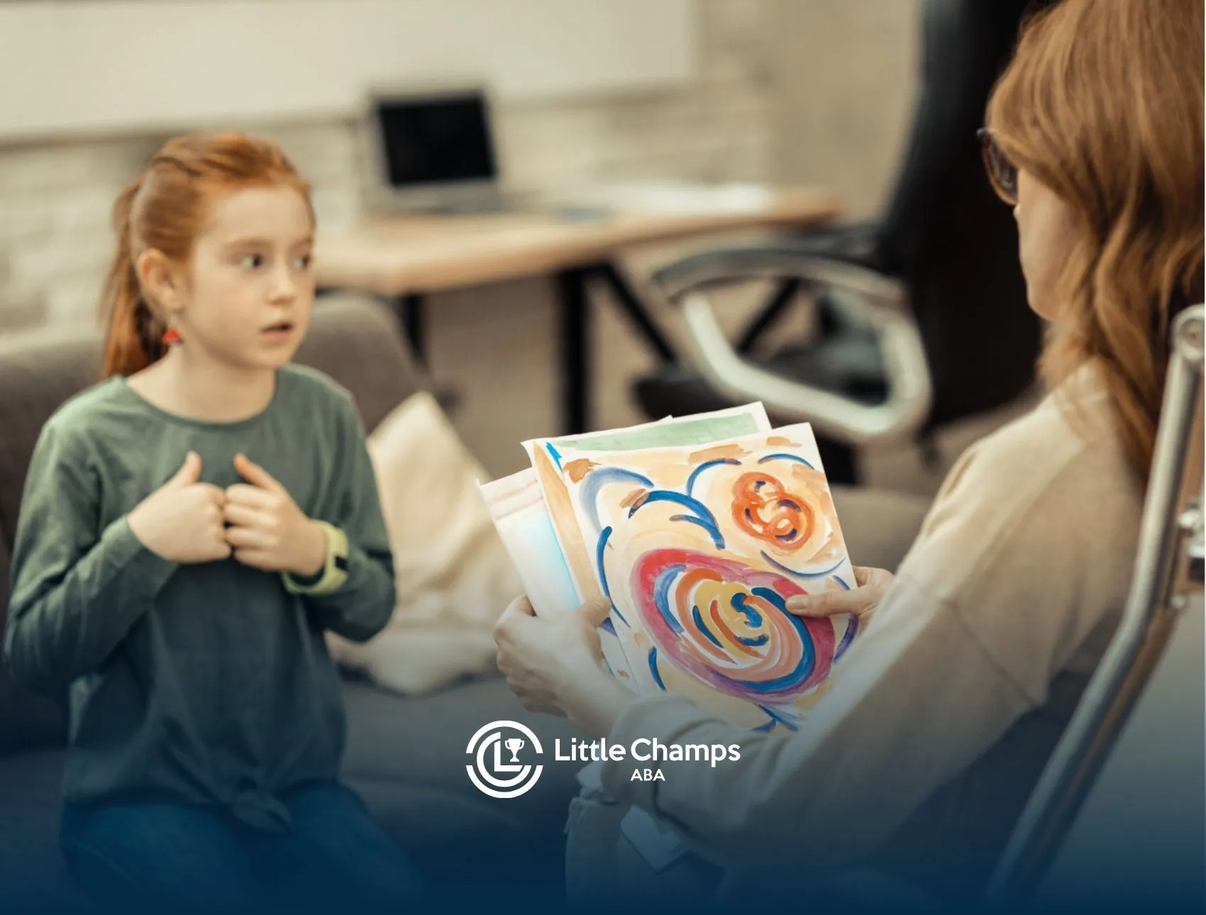 Autistic girl interacting with ABA therapist, showing artwork during a therapy session.