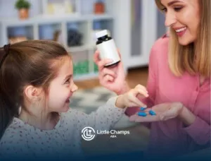 Autistic girl taking medications from her mother.