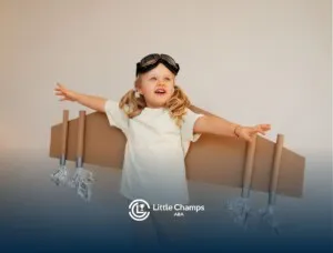 Autistic girl wearing a makeshift cardboard airplane and goggles.