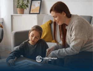 An ABA therapist and a girl with autism during their ABA therapy session