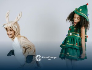 Two autistic children in festive costumes, one as a reindeer and the other as a Christmas tree in UT.