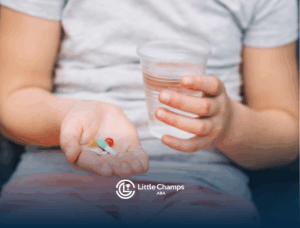 A person with autism is holding a glass of water and a few supplements