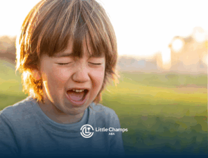 A kid with autism with his mouth open and his two eyes closed