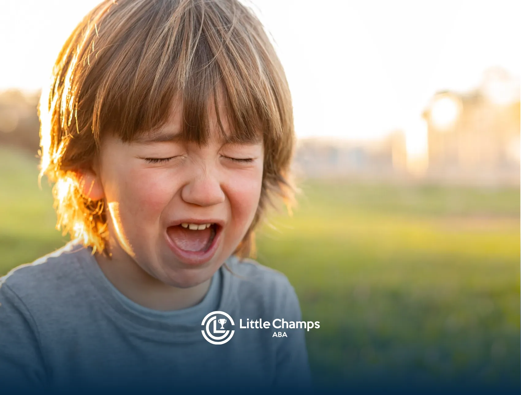 A kid with autism with his mouth open and his two eyes closed
