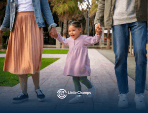 A child with autism holding both of her parents' hands while walking outdoors