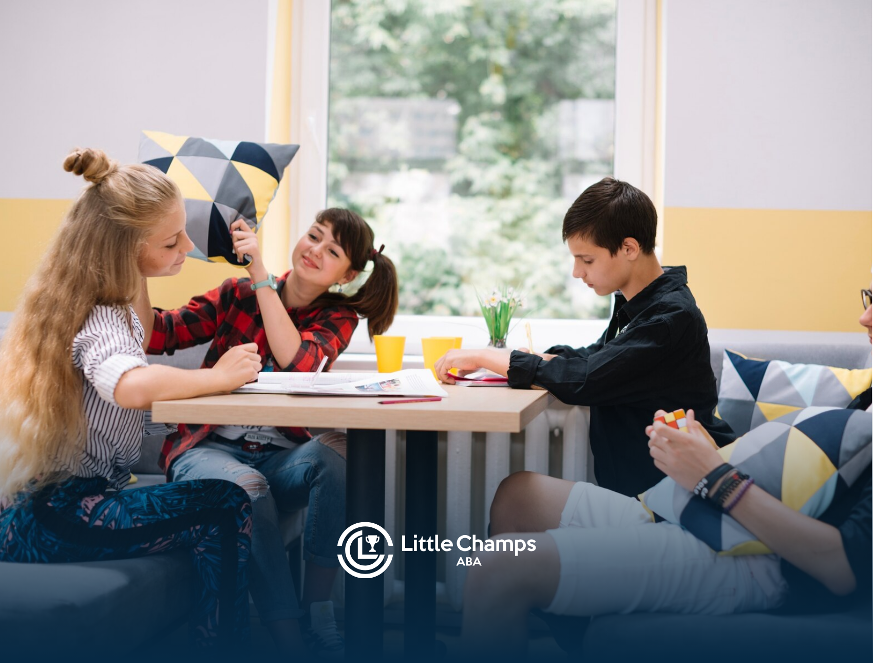 Teenagers with autism socializing together during ABA therapy