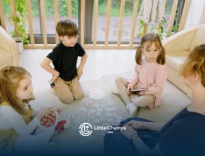 Autistic kids playing educational matching game on the floor with an ABA therapist at home in CO.