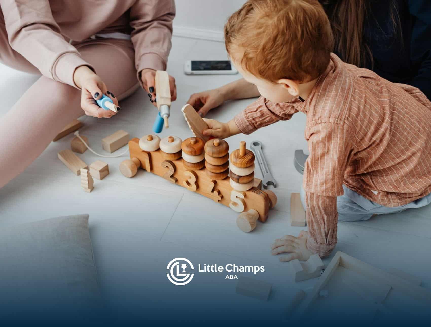 An autistic toddler playing with wooden educational toy numbers and shapes with adults nearby in UT.