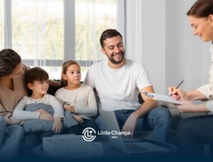 Family meeting with behavioral therapist, part of parent training in ABA therapy.