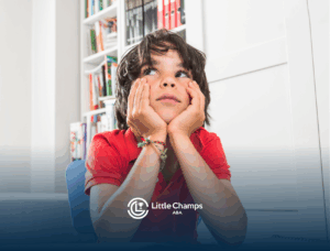 A child with autism is looking up while sitting at a table