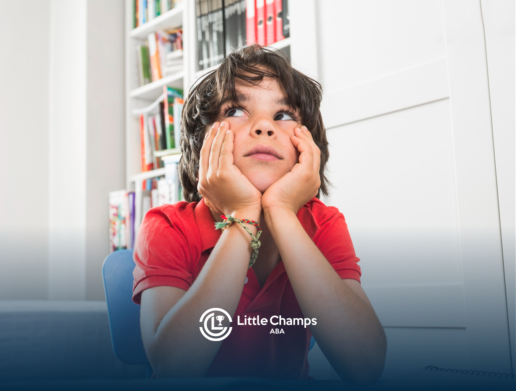 A child with autism is looking up while sitting at a table