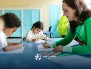 Autistic children and an RBT doing writing activity during a classroom ABA therapy session in CO.