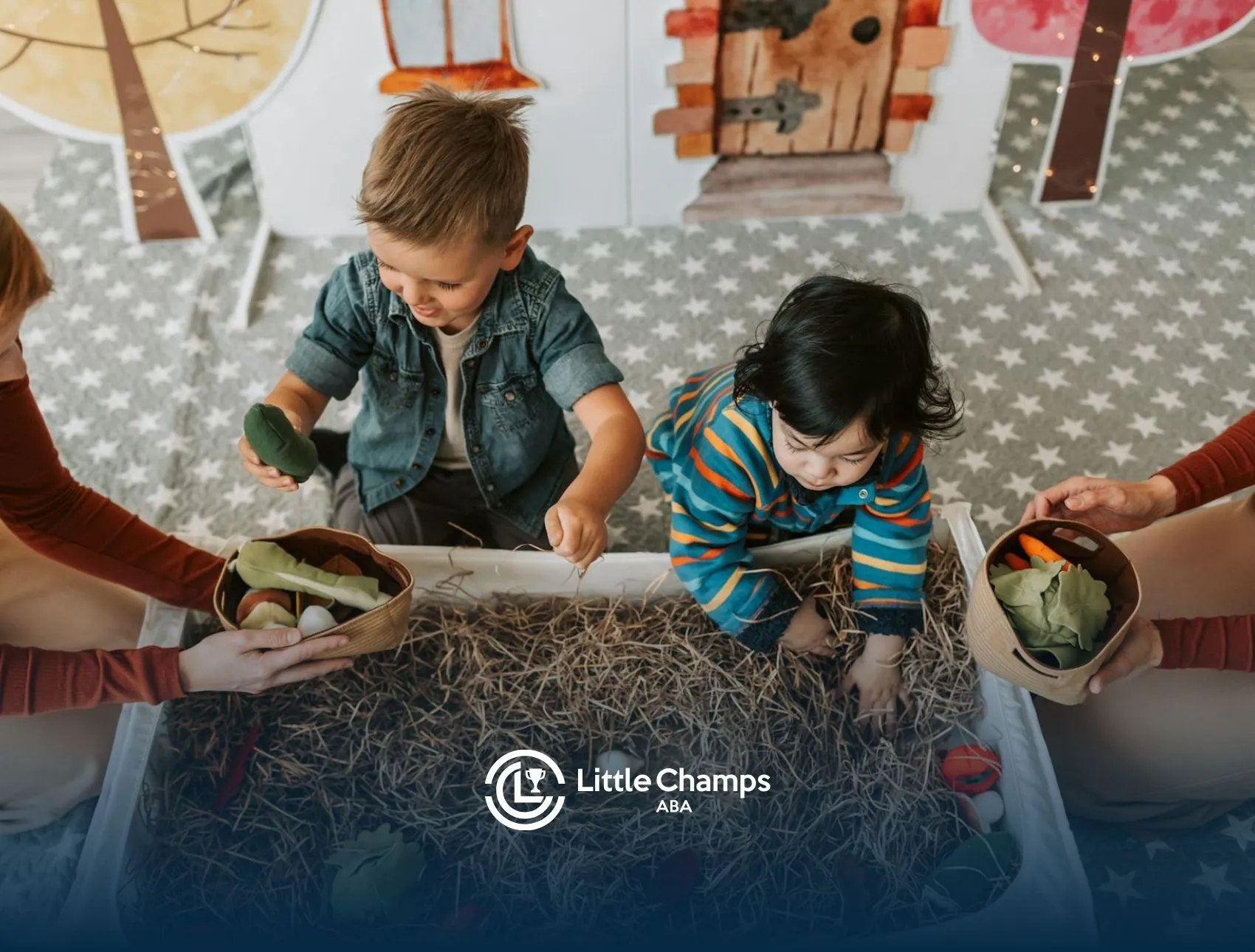 Autistic children exploring sensory bin with play vegetables during ABA therapy session in Utah.
