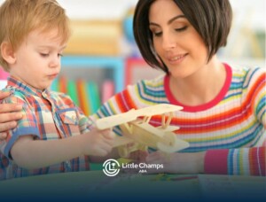 ABA therapist and boy playing with a wooden airplane in ABA therapy.