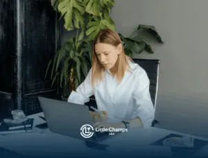 An RBT student studying on a laptop for RBT certification in a stylish office space with indoor plants in Utah.