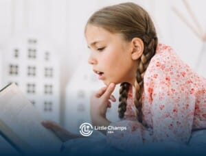 A girl with autism reading a book with focus and curiosity.