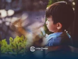 Young boy with severe autism looking at his reflection in a window.