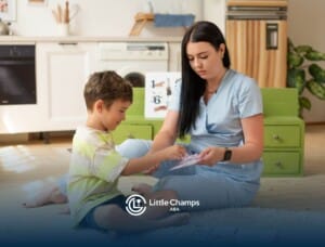 BCBA working with autistic on ABA therapy learning activity at home.