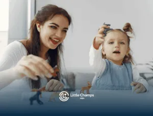 An ABA therapist and autistic child playing with animal figurines at a table during ABA therapy session in Utah.
