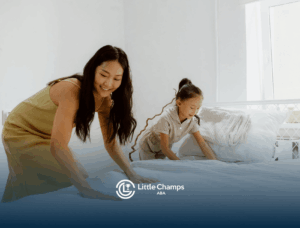 An ABA therapist and autistic girl using discrete trial teaching technique and making the bed together in UT.