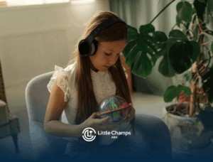 An autistic girl wearing noise-canceling headphones holding a colorful puzzle ball during ABA therapy in CO.
