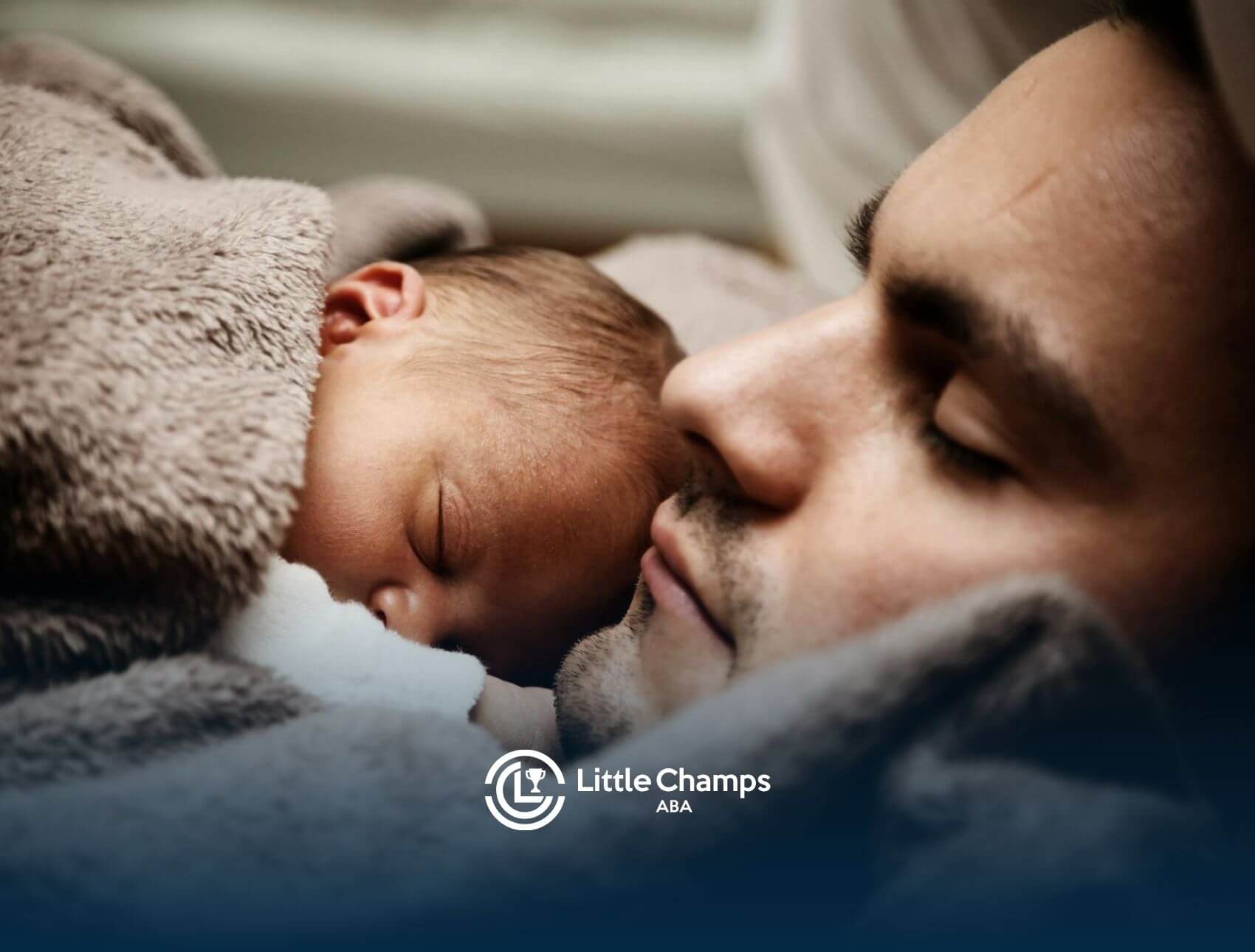 Autistic father sleeping peacefully beside a newborn baby wrapped in a blanket in Colorado after ABA therapay.