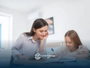 BCBA watching girl write in a notebook at desk in ABA therapy.
