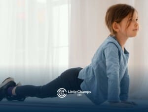 A young girl with autism practicing yoga in a bright room during ABA therapy session.