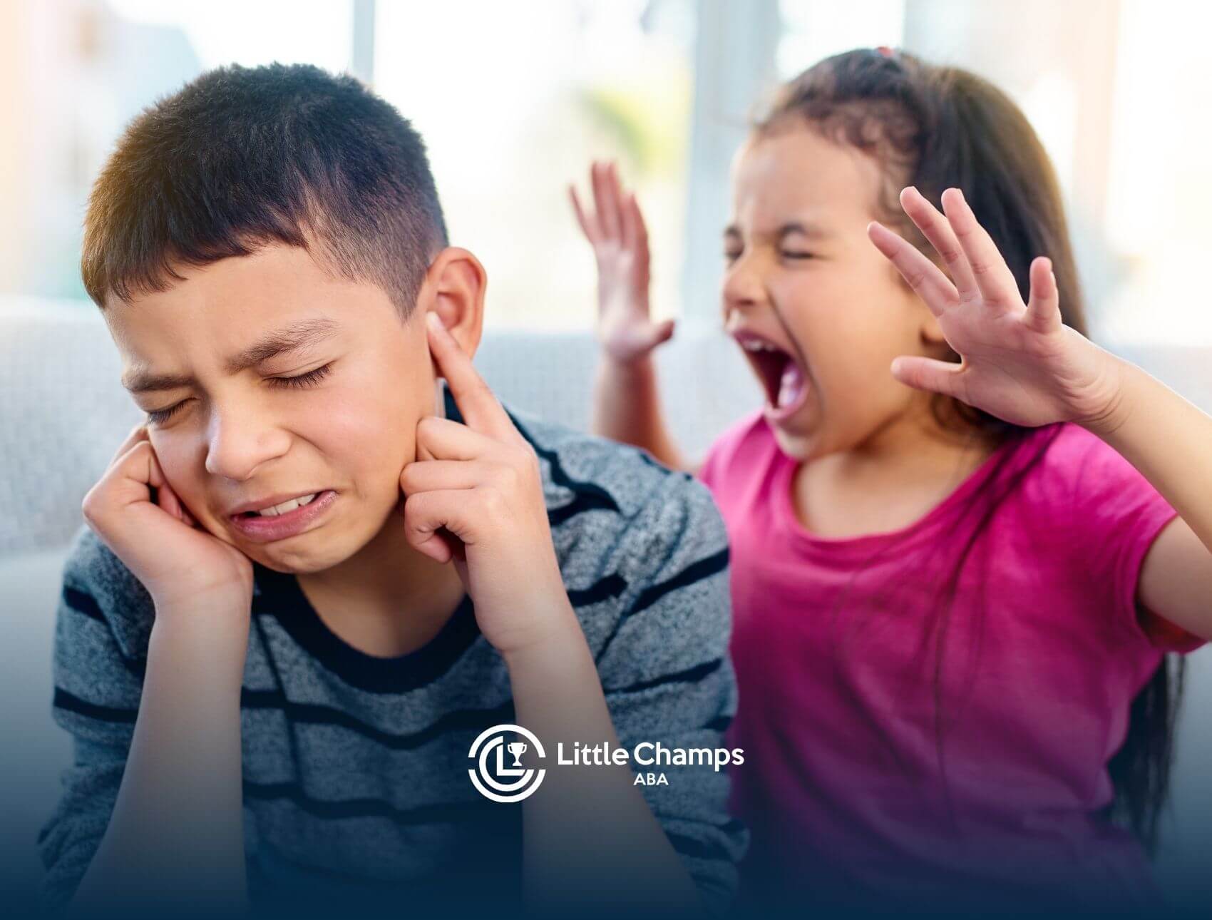 A frustrated child pulling their hair in distress, expressing strong emotion while sitting in a neutral setting.