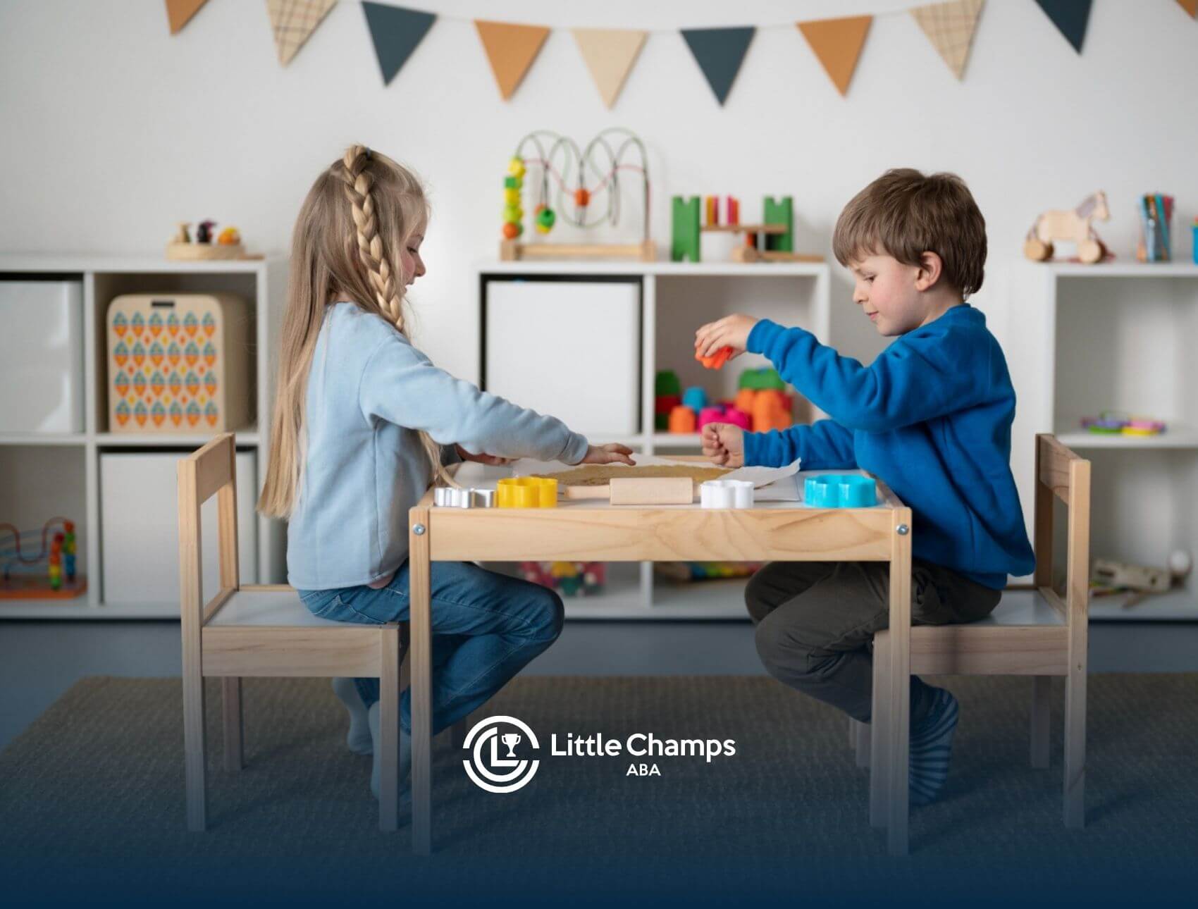 Two young children playing with educational toys at a table during ABA therapy.