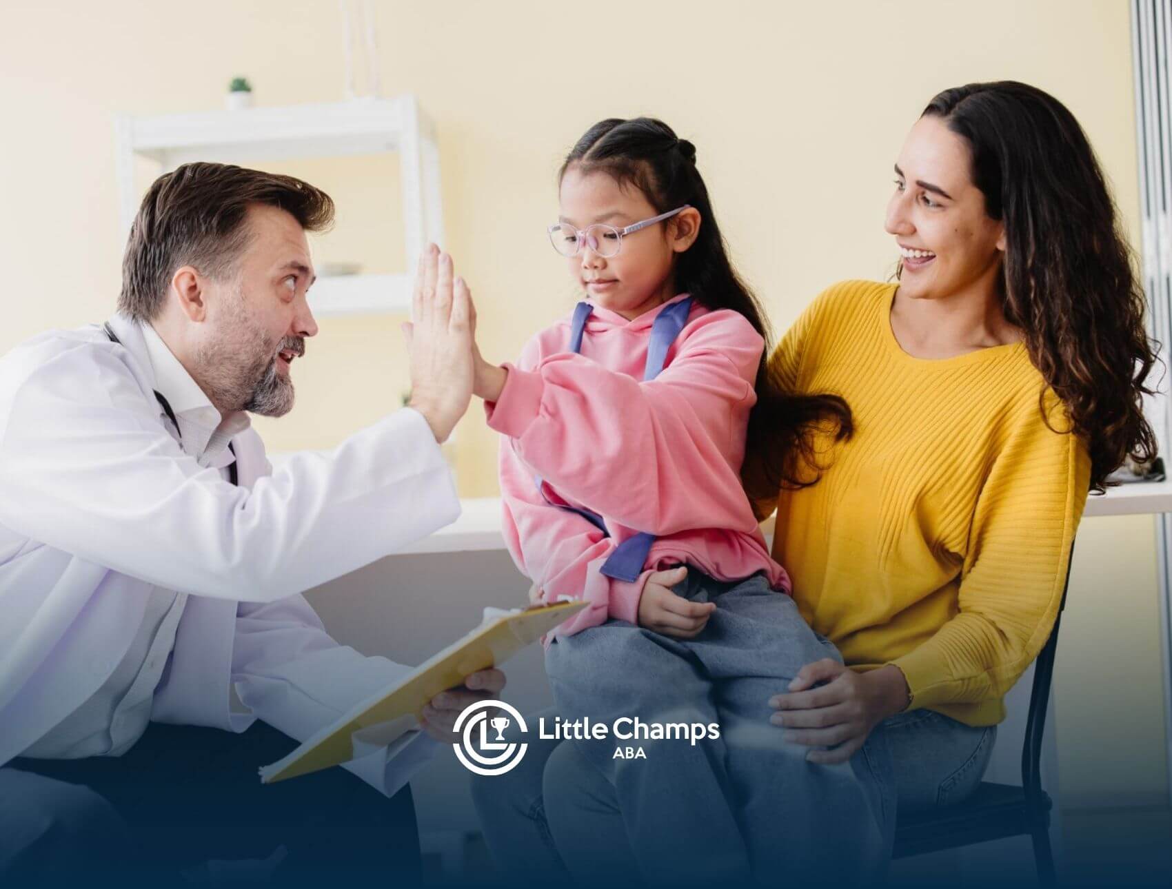 Doctor high-fiving young girl while mother smiles beside them after an autism evaluation.