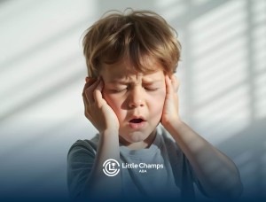 Young boy with autism covering ears, appearing overwhelmed by noise.