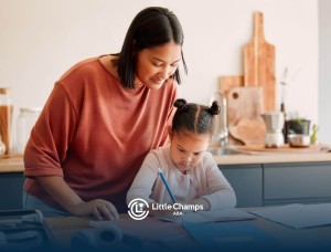 BCBA helping young girl with a task at kitchen table in ABA therapy.