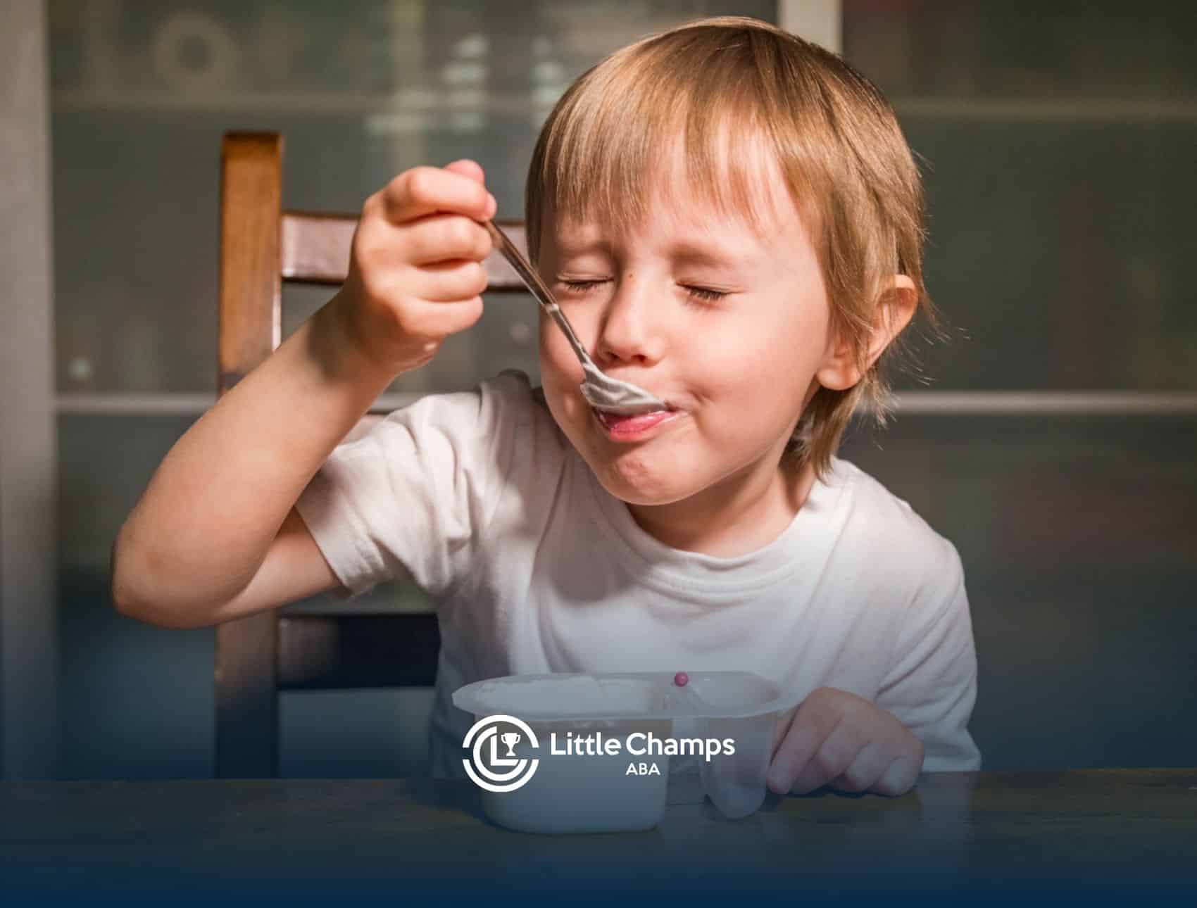 A child with autism eating yogurt.