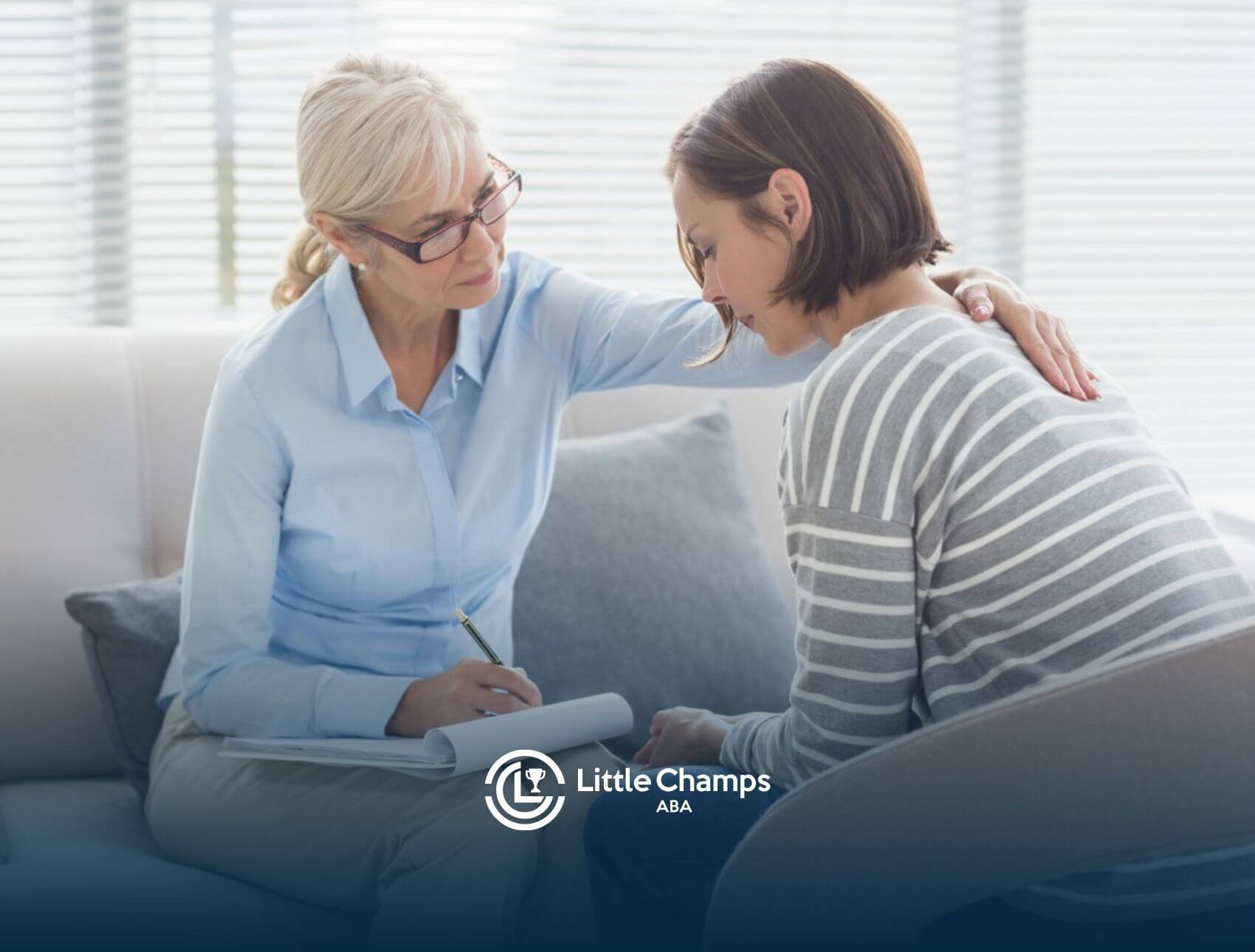 BCBA offering emotional support to a woman with autism during a session.