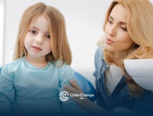 ABA therapist gently talking to young child.