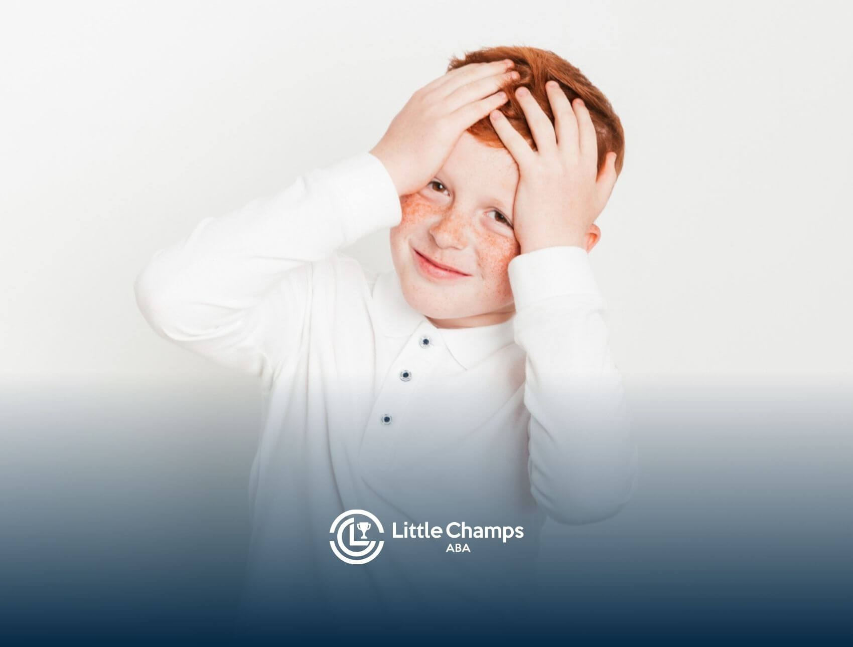 Smiling child with hands on head against a white background.