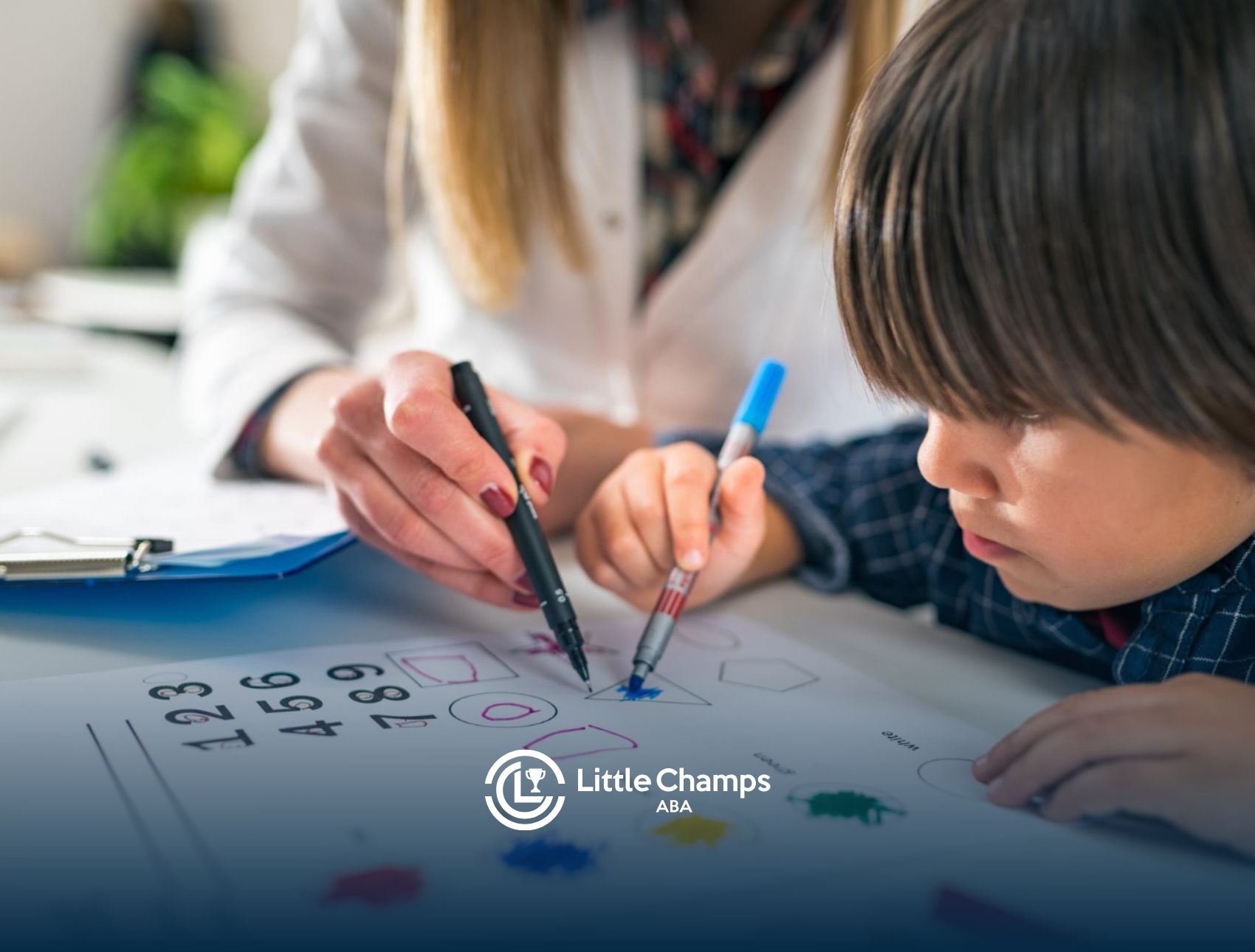 Child with autism completing a learning worksheet with guidance from BCBA.