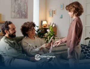 Child practicing social skills with parents during an ABA therapy activity at home.
