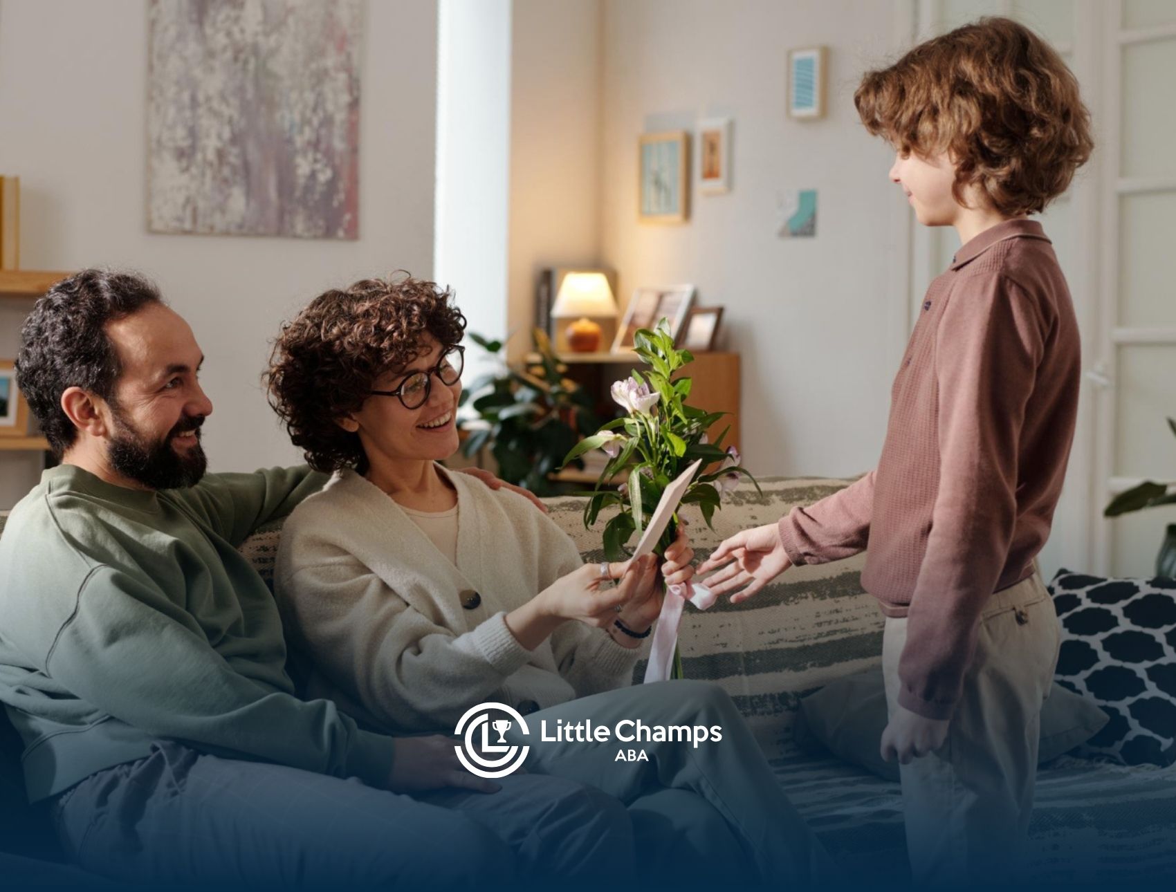 Child practicing social skills with parents during an ABA therapy activity at home.