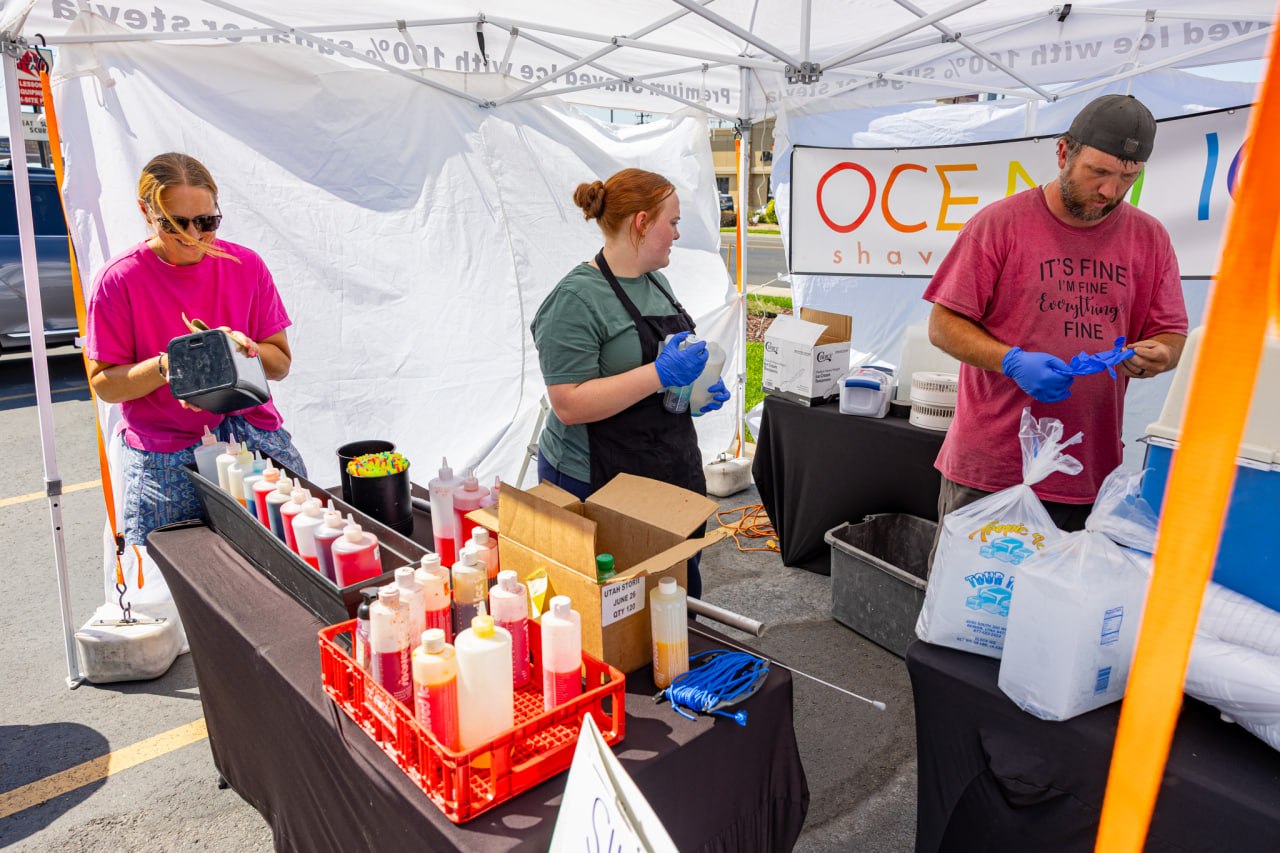 Shaved ice vendors preparing treats at the Cottonwood Heights center opening.