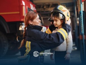 Firefighter fitting a child with a helmet.