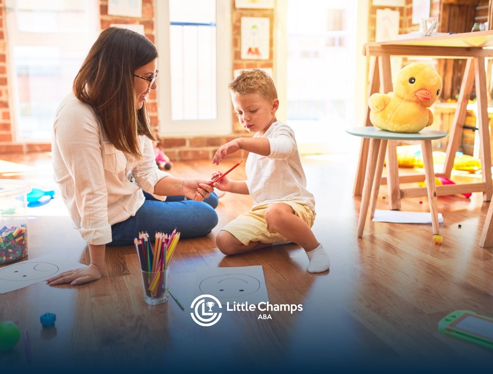 ABA therapist helping a child with a learning activity during an ABA therapy session.