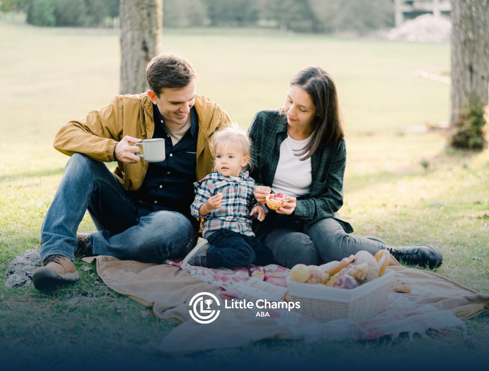 Family enjoying a picnic together at a park.