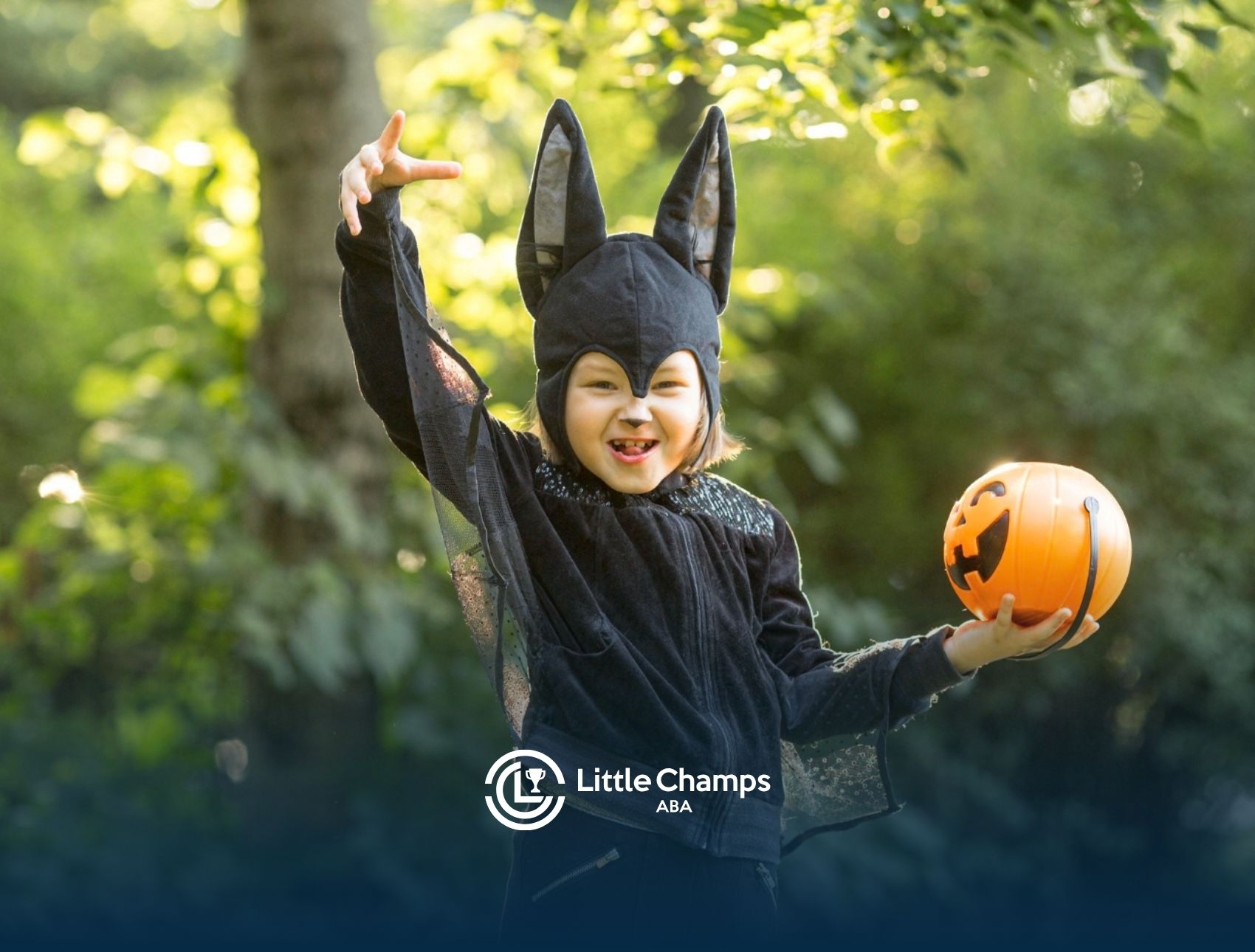 Child with autism dressed for Halloween holding a pumpkin bucket.