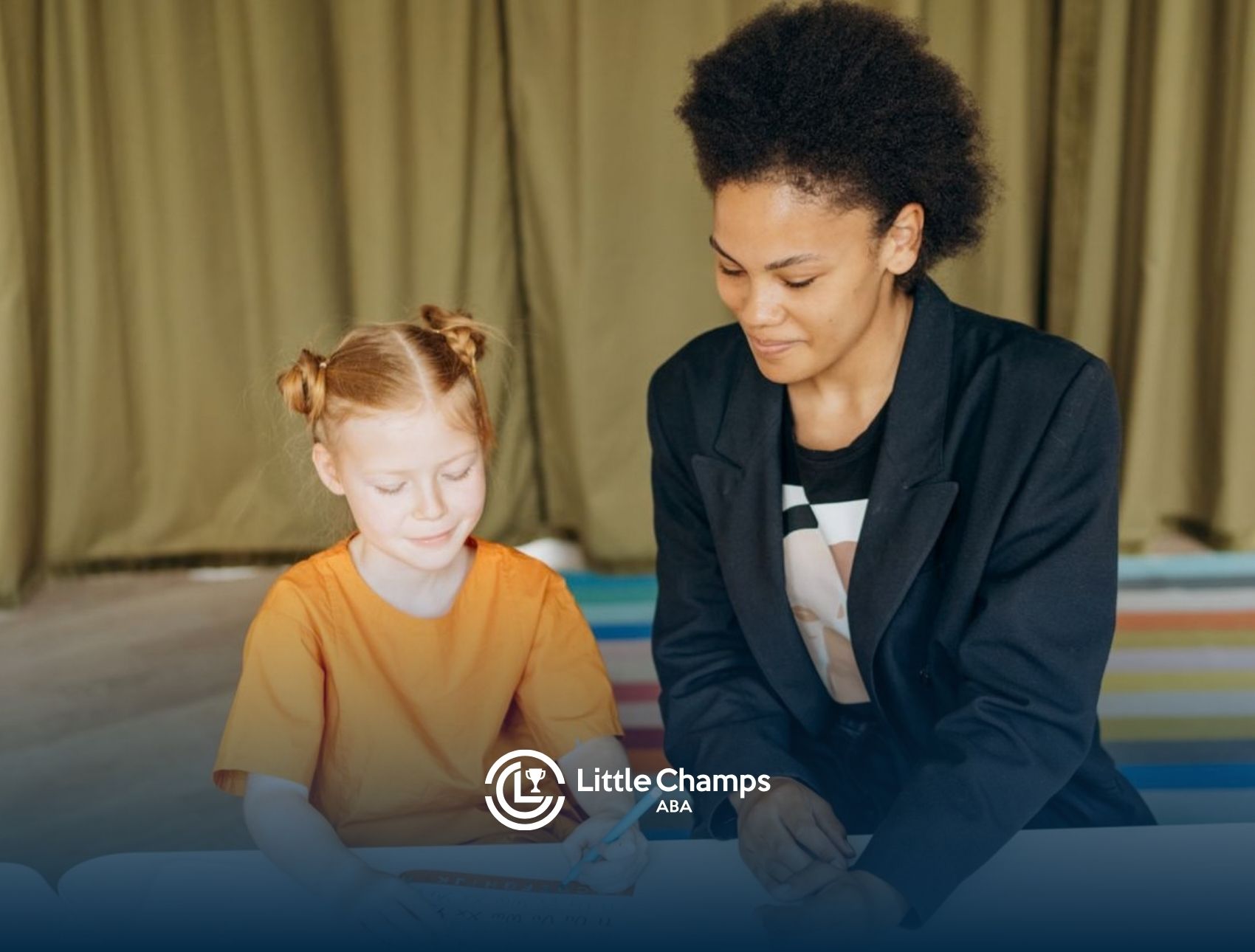ABA therapist helping a young child complete a learning activity during a therapy session.