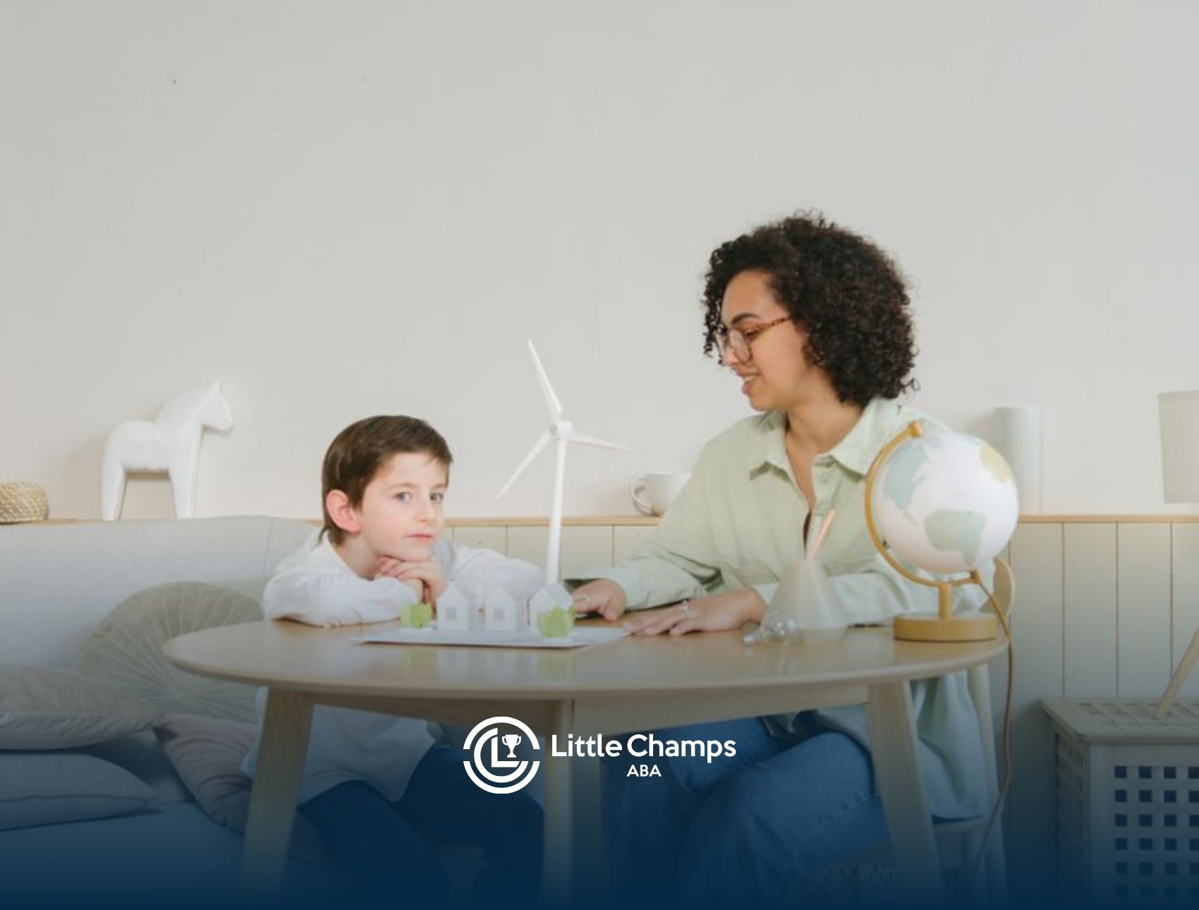 Child participating in a play-based ABA therapy activity with a therapist to build trust and comfort.
